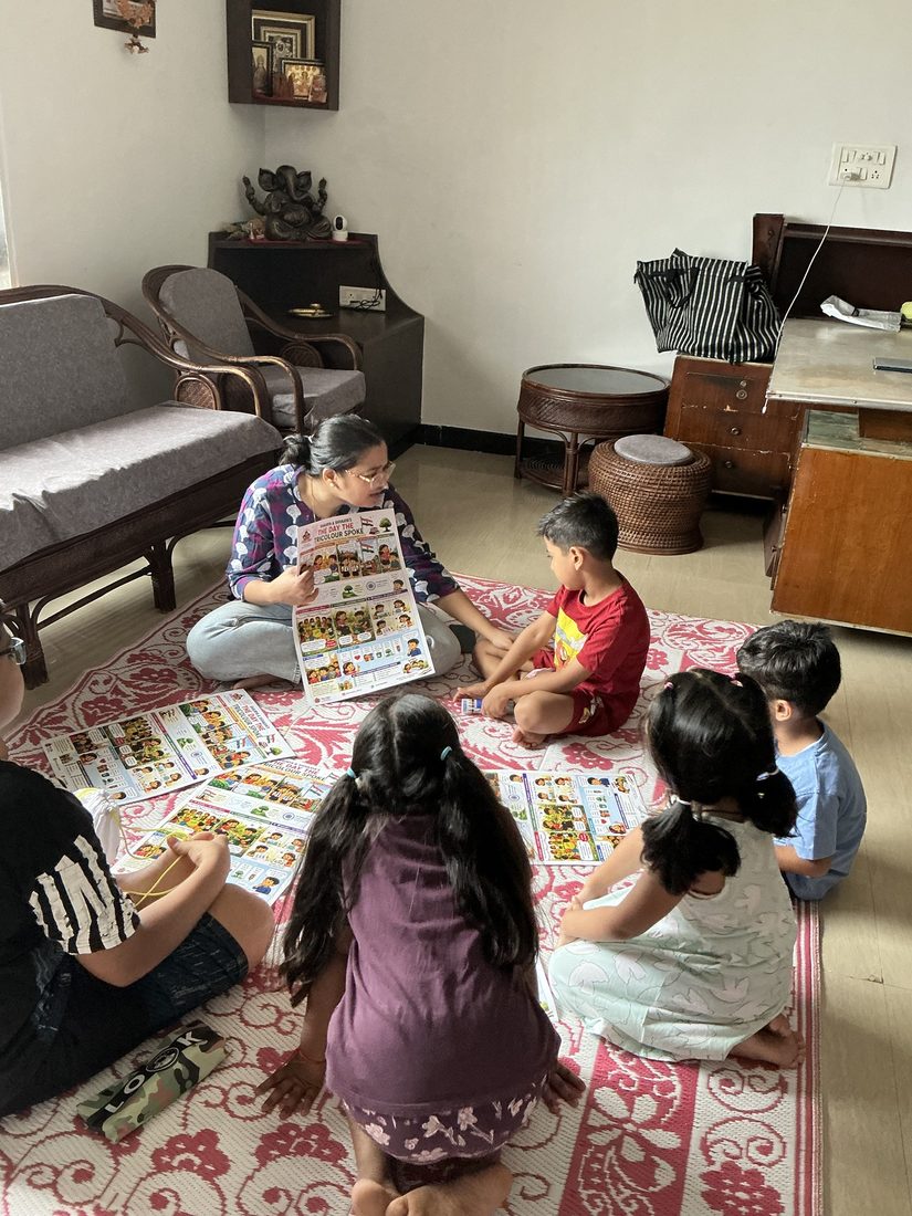 Mamta showing a chart to the children