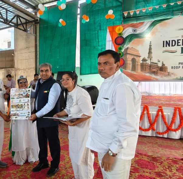 Guests with the chart at the Independence Day celebration